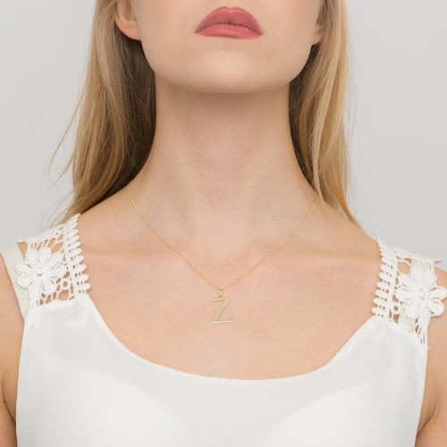 Złota zawieszka litera W z brylantem