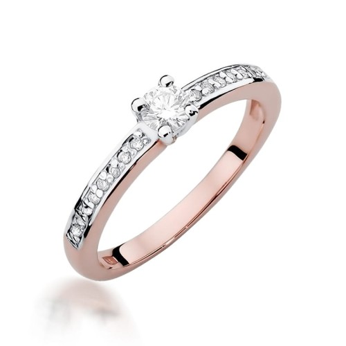 Pierścionek z różowego złota z brylanem centralnym oraz na szynie