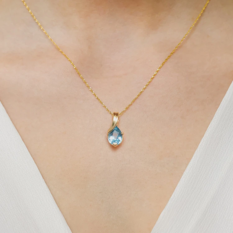 Złota zawieszka z Topazem Swiss 0,90 ct łezka