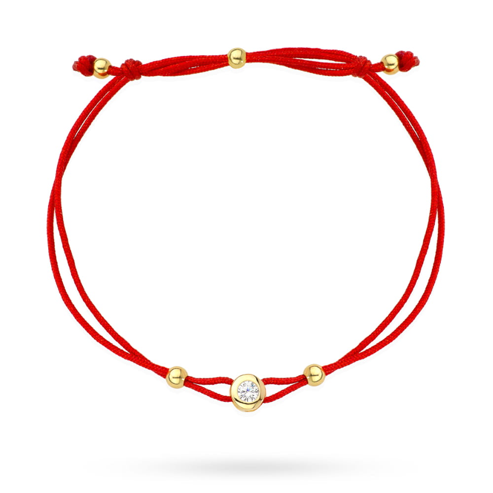 Bransoletka złote kółko z centralnym kamykiem na czerwonym sznurku